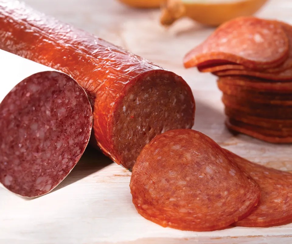 Smoked salami in fibrous casing, with slices