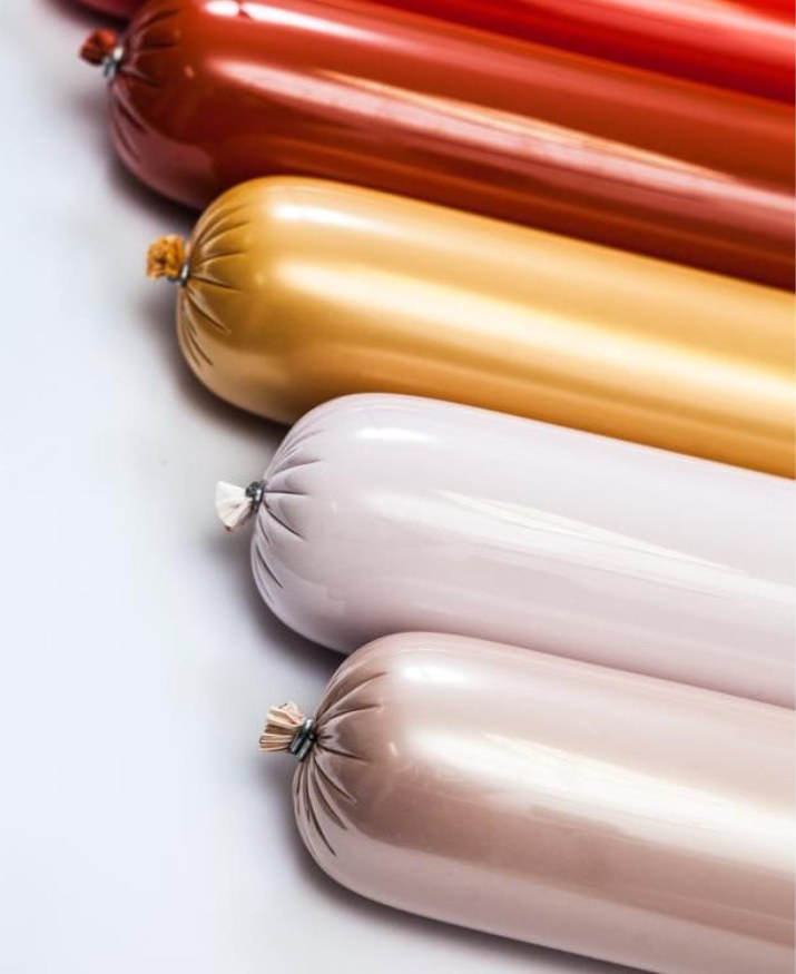 Meat products in coloured plastic casings